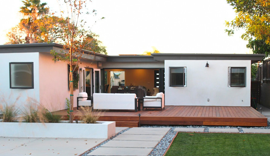 Large contemporary backyard deck in San Diego with no cover.