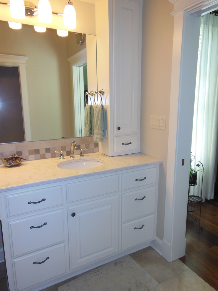 Photo of a large traditional master bathroom in Little Rock with raised-panel cabinets, white cabinets, grey walls and engineered quartz benchtops.