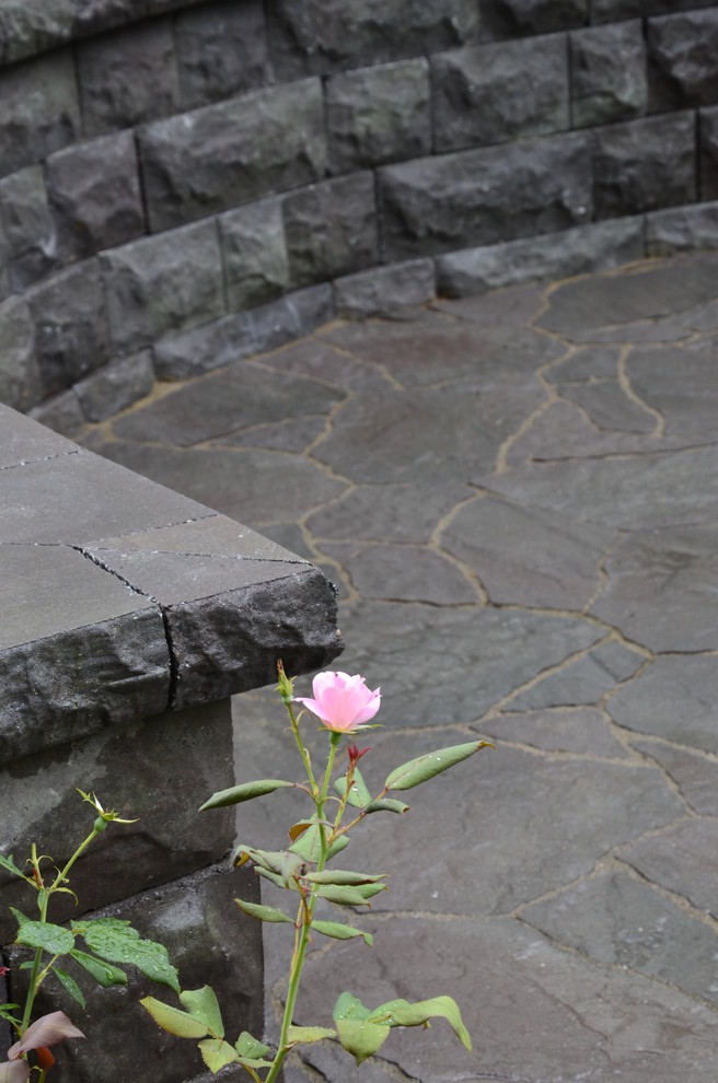 Inspiration for a transitional backyard patio in DC Metro with concrete pavers.