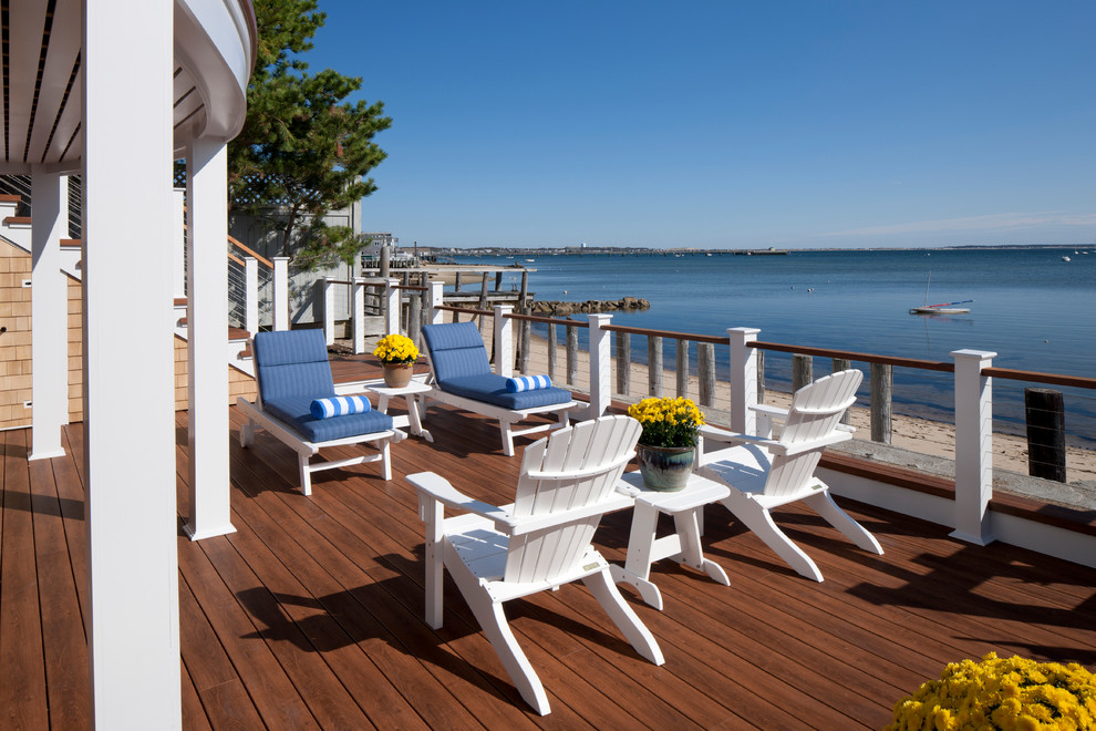 Design ideas for a large beach style backyard deck in Boston with no cover.