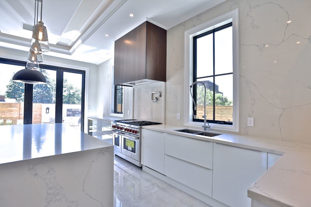 Inspiration for a large modern kitchen in Toronto with an undermount sink, flat-panel cabinets, white cabinets, quartz benchtops, yellow splashback, marble splashback, stainless steel appliances, porcelain floors, with island, beige floor and yellow benchtop.