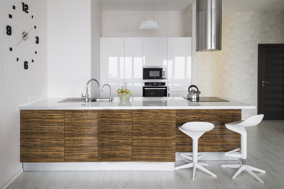 Photo of a contemporary open plan kitchen in Moscow with a drop-in sink, flat-panel cabinets and with island.