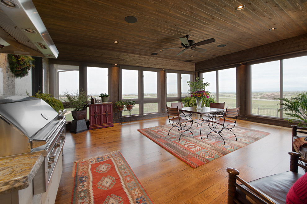 Photo of an expansive arts and crafts sunroom in Denver.