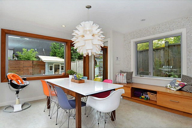 Large contemporary kitchen/dining combo in Vancouver with white walls and concrete floors.