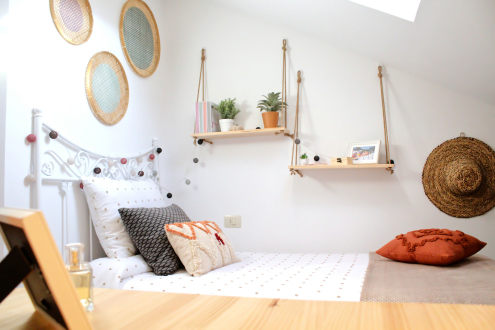 Photo of a small beach style teen’s room for girls in Other with white walls, dark hardwood flooring, brown floors and a vaulted ceiling.