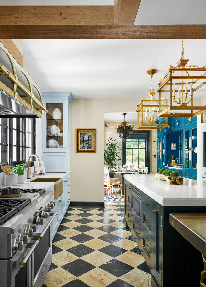 Large traditional eat-in kitchen in Chicago with a farmhouse sink, recessed-panel cabinets, blue cabinets, quartz benchtops, white splashback, marble splashback, stainless steel appliances, marble floors, with island, white floor, white benchtop and exposed beam.