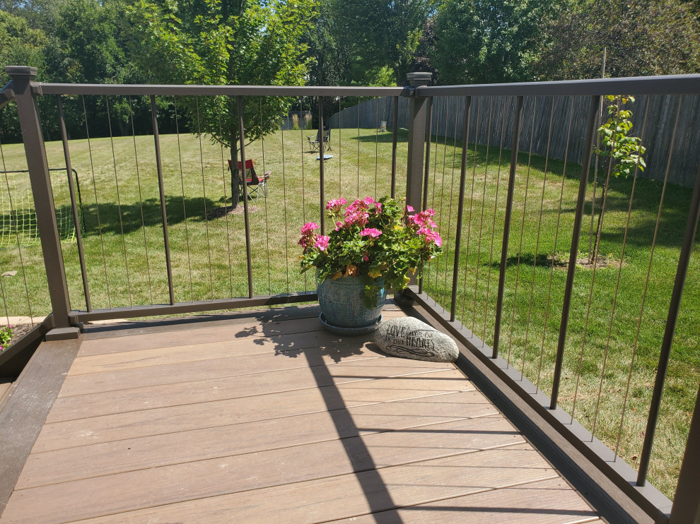 Inspiration for a mid-sized backyard second story cable railing deck remodel with no cover