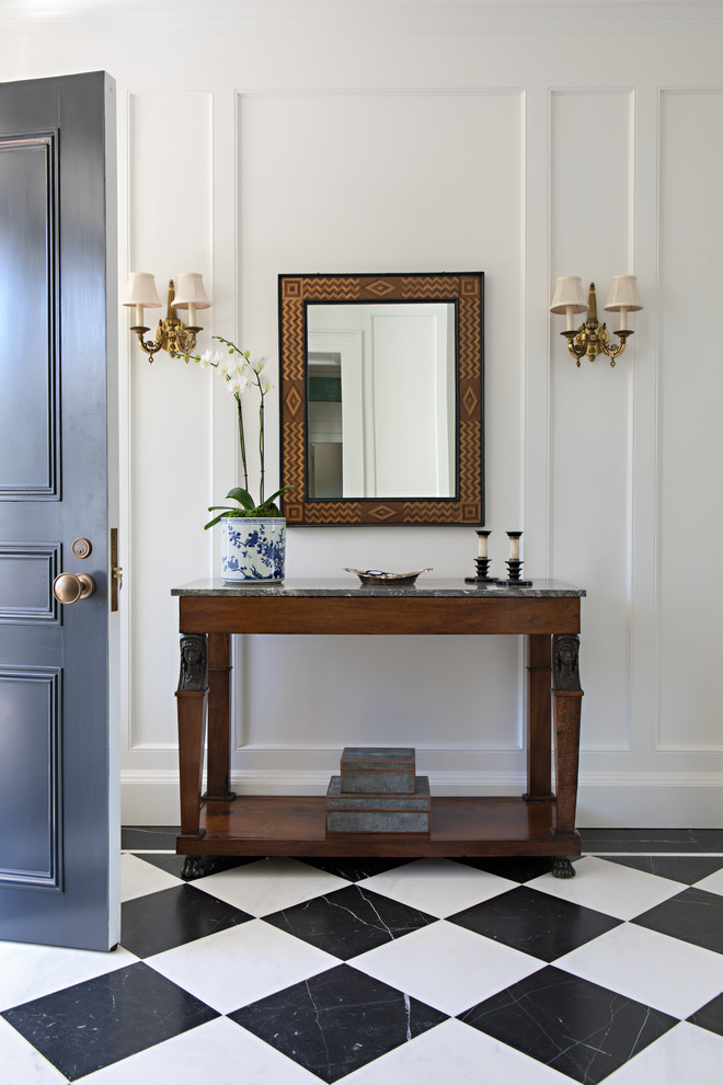 Design ideas for a traditional entryway in Santa Barbara with white walls, marble floors and multi-coloured floor.