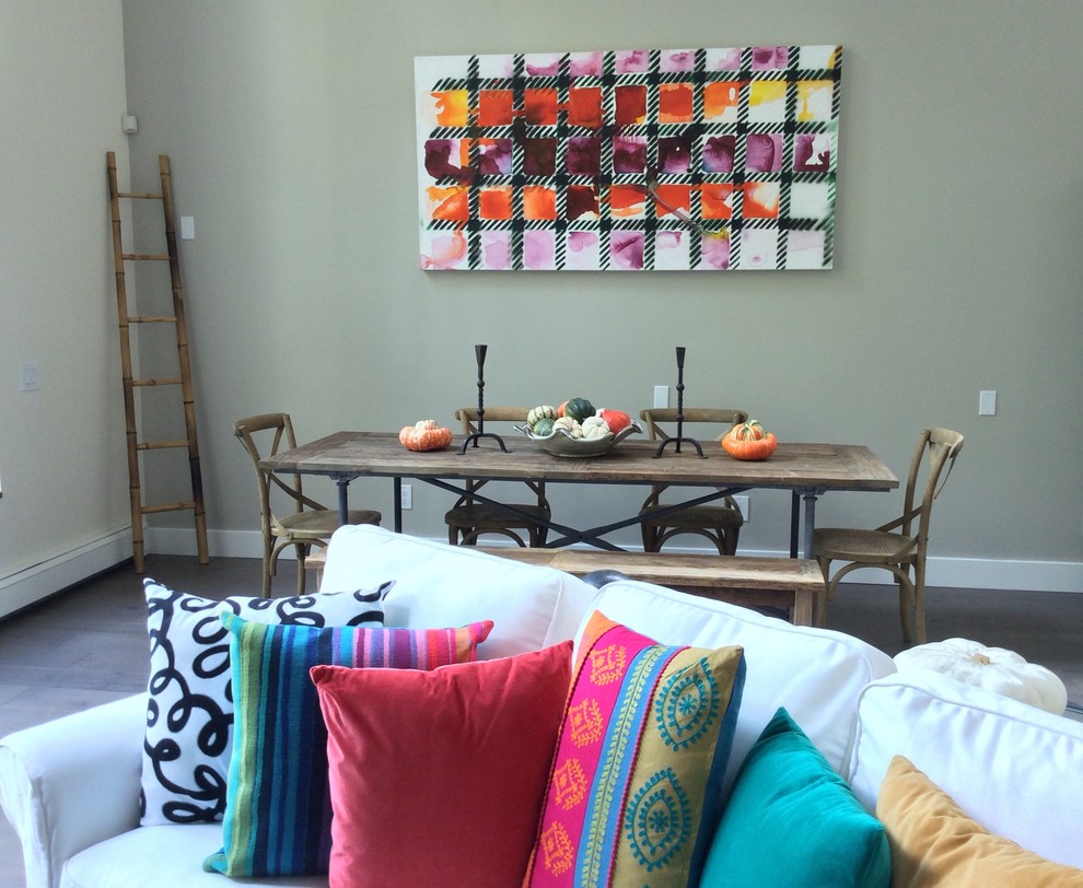Fun modern art and pillows add some drama to the gloomy space