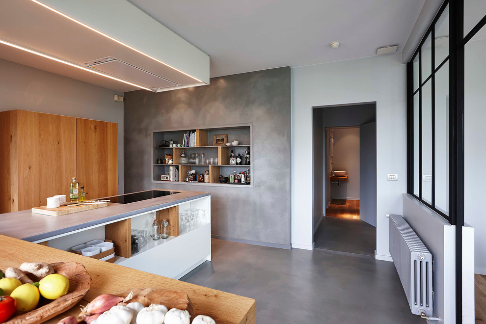 Mid-sized contemporary l-shaped eat-in kitchen in Paris with open cabinets, medium wood cabinets, concrete floors, multiple islands and wood benchtops.