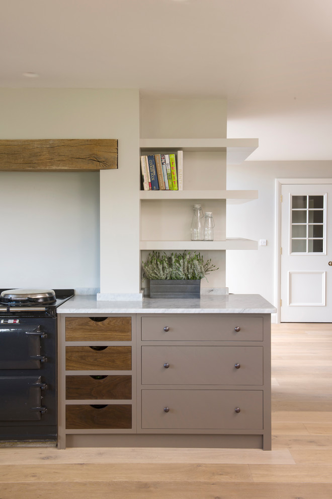 Design ideas for a transitional kitchen in Sussex.
