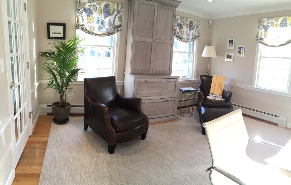 Mid-sized transitional study room in Boston with beige walls, carpet, no fireplace, a built-in desk and brown floor.