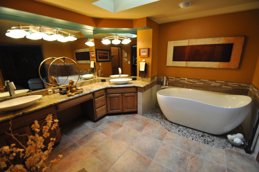 Photo of a mid-sized eclectic master bathroom in Seattle with a freestanding tub, an open shower, multi-coloured tile, porcelain tile, yellow walls, porcelain floors, a vessel sink and granite benchtops.
