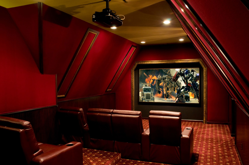 This is an example of a large traditional enclosed home theatre in Other with red walls, carpet, a projector screen and red floor.