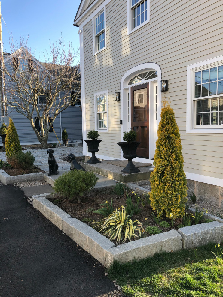 Inspiration for a mid-sized timeless front door remodel in Bridgeport with a brown front door