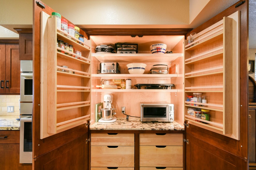 Design ideas for a large galley kitchen pantry in San Luis Obispo with an undermount sink, recessed-panel cabinets, medium wood cabinets, granite benchtops, white splashback, subway tile splashback, stainless steel appliances, porcelain floors, a peninsula and beige floor.