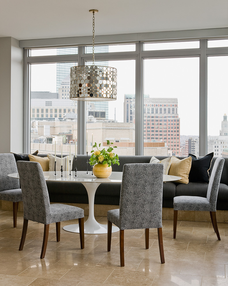 Photo of a contemporary dining room in Boston with grey walls, travertine floors and beige floor.