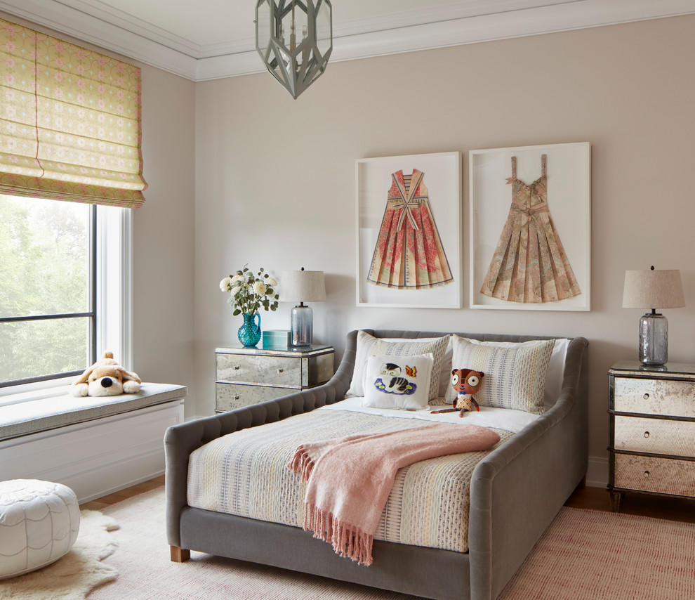 This is an example of a transitional kids' room in Chicago with beige walls, medium hardwood floors and brown floor.
