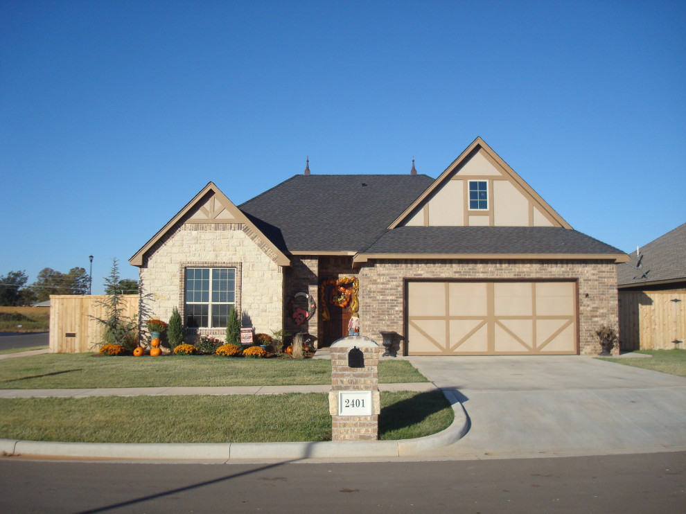 Traditional double car garage with stone and brick