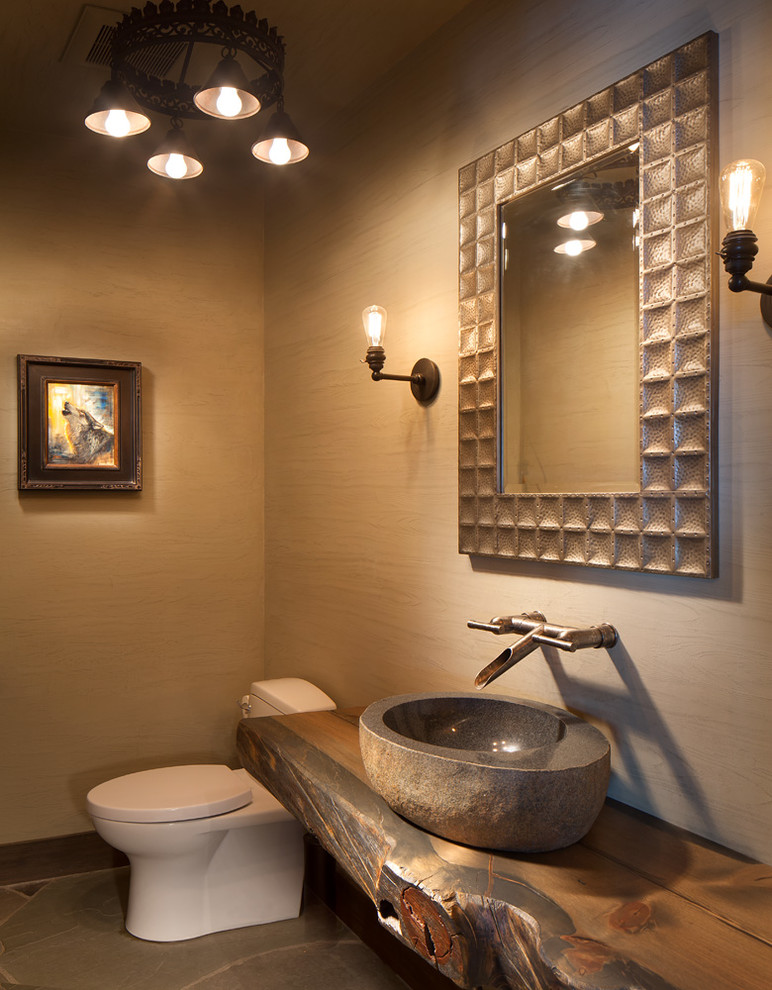Design ideas for a country powder room in Seattle with beige walls, a vessel sink and grey floor.