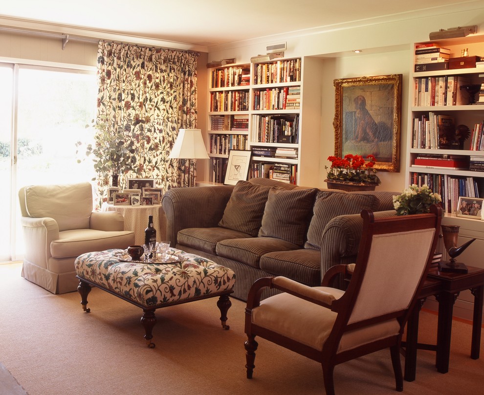 Traditional living room in Los Angeles with a library.