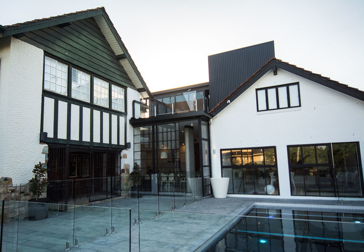 Design ideas for a mid-sized contemporary two-storey concrete grey duplex exterior in Brisbane with a gable roof and a shingle roof.