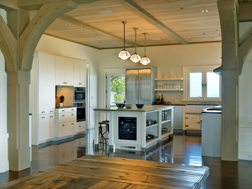 Traditional kitchen in Boston with a farmhouse sink and stainless steel appliances.