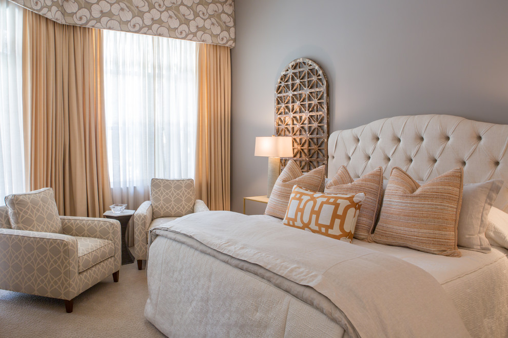 This is an example of a transitional master bedroom in Miami with grey walls and carpet.