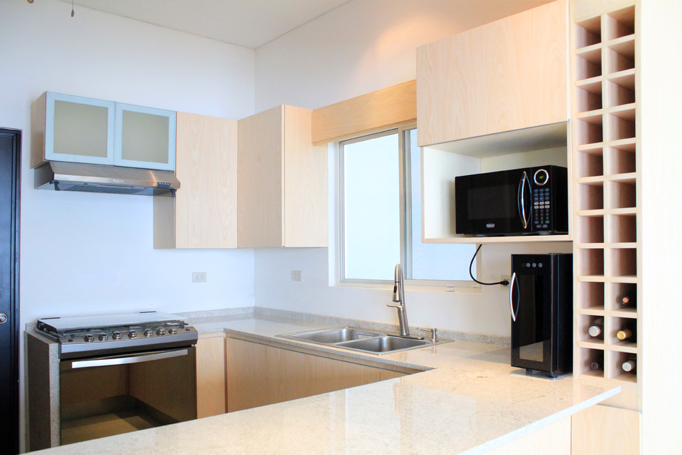 Inspiration for a mid-sized modern u-shaped porcelain tile eat-in kitchen remodel with a double-bowl sink, flat-panel cabinets, light wood cabinets, granite countertops and stainless steel appliances