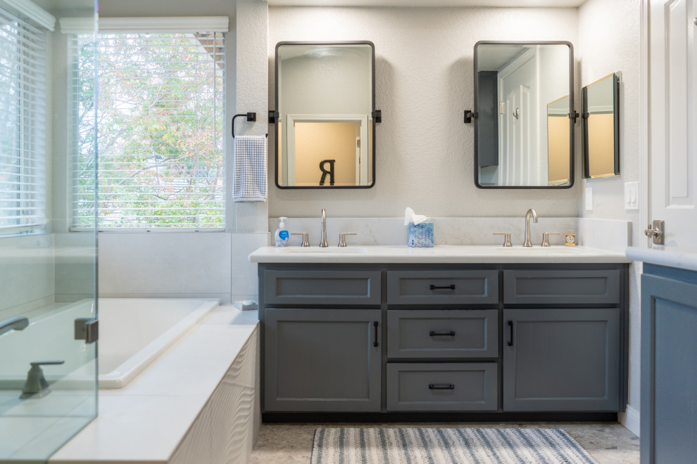 Inspiration for a modern master double-sink bathroom remodel in Sacramento with shaker cabinets, blue cabinets, an undermount sink, quartz countertops, a hinged shower door, white countertops and a built-in vanity