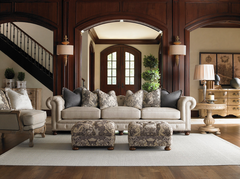 Inspiration for a large mediterranean open concept living room in Salt Lake City with beige walls, carpet and no fireplace.