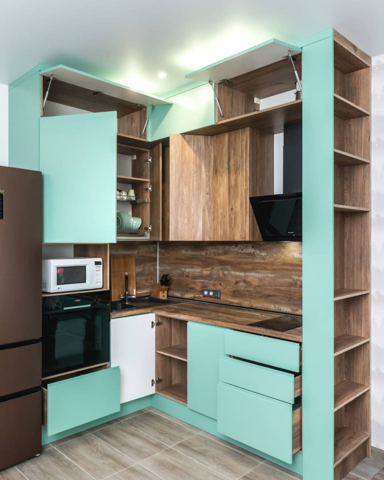 Photo of a small scandi l-shaped open plan kitchen in Moscow with a built-in sink, flat-panel cabinets, turquoise cabinets, wood worktops, brown splashback, wood splashback, black appliances, lino flooring, no island, brown floors and brown worktops.