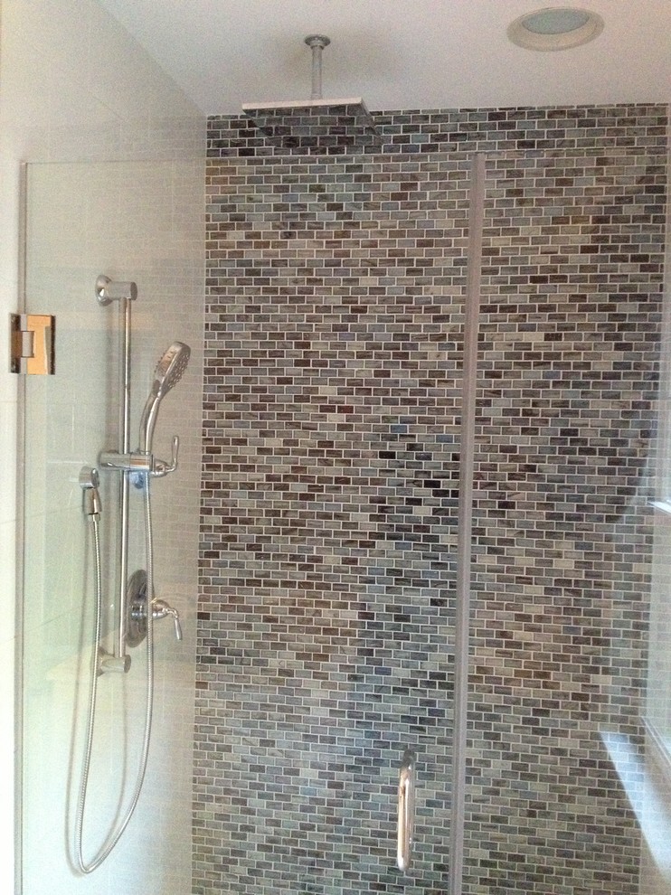 Example of a large transitional master multicolored tile and mosaic tile marble floor drop-in bathtub design in DC Metro with recessed-panel cabinets, white cabinets, a two-piece toilet, gray walls, an undermount sink and marble countertops