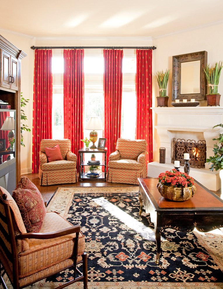 This is an example of a traditional family room in Dallas with beige walls and a corner fireplace.