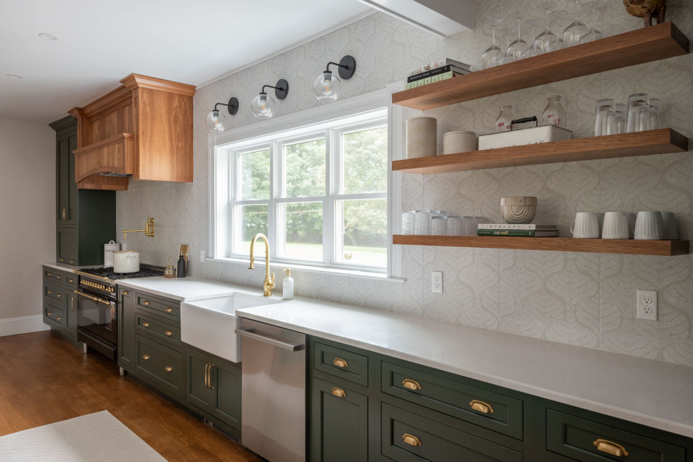 Huge transitional medium tone wood floor and brown floor eat-in kitchen photo in Boston with a farmhouse sink, shaker cabinets, green cabinets, quartz countertops, beige backsplash, an island and white countertops