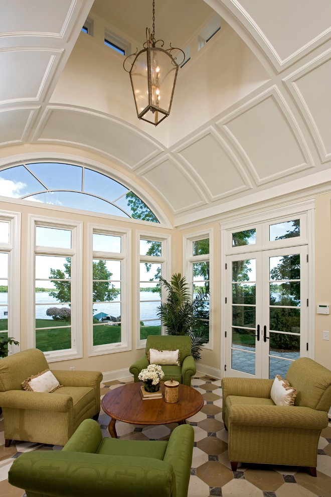 Large traditional sunroom in Minneapolis with a skylight, vinyl floors, no fireplace and multi-coloured floor.