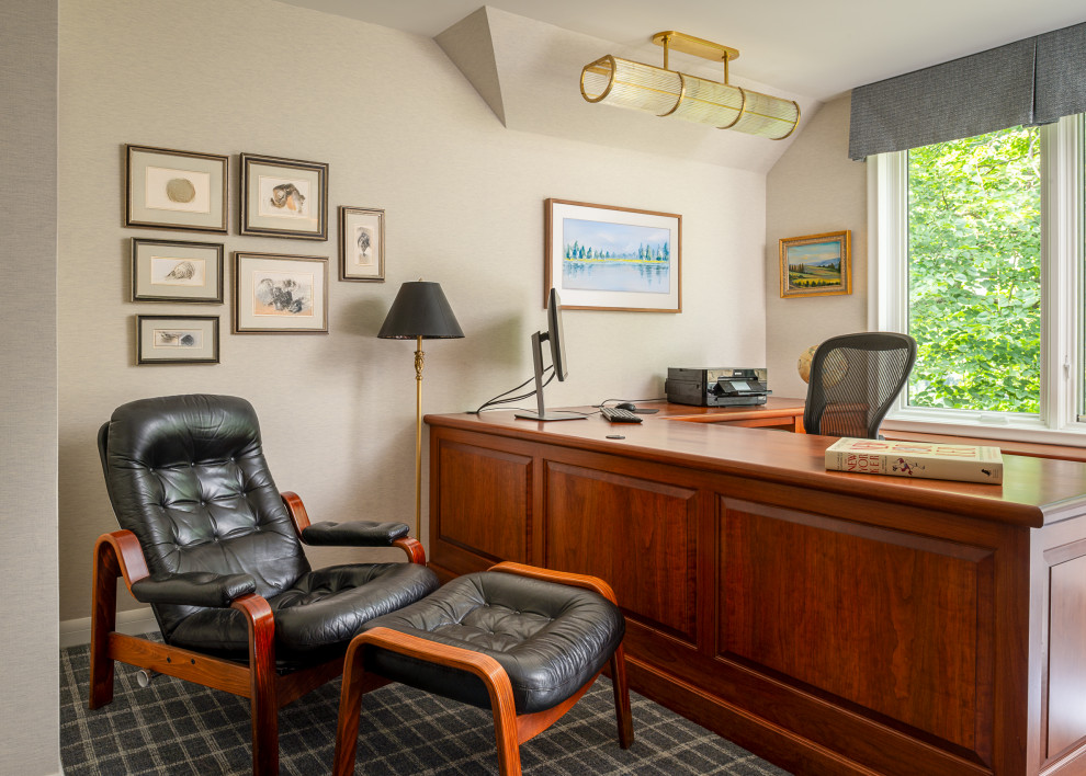 Example of a mid-sized trendy built-in desk carpeted and gray floor study room design in Minneapolis with beige walls