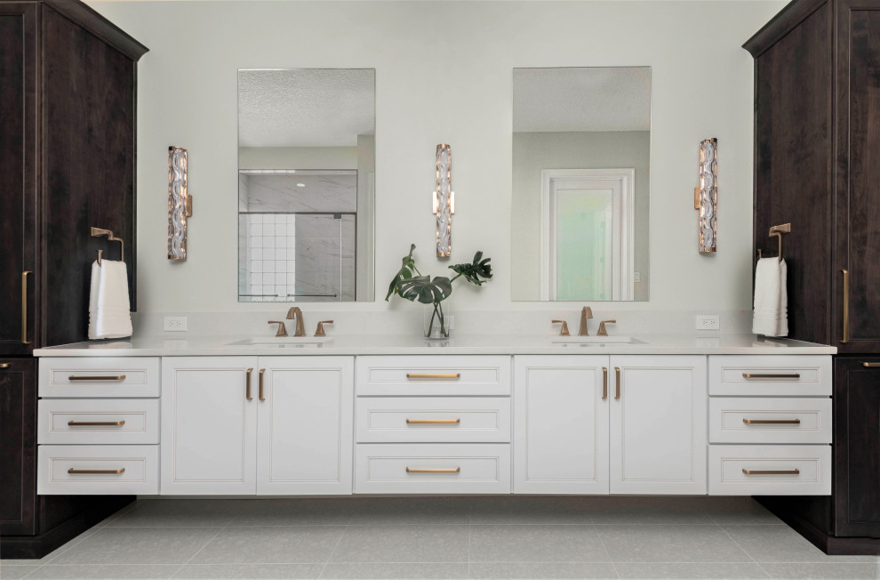 Huge transitional master gray tile and porcelain tile porcelain tile, white floor, double-sink and wallpaper bathroom photo in Orlando with recessed-panel cabinets, white cabinets, white walls, an undermount sink, quartz countertops, a hinged shower door, white countertops and a floating vanity