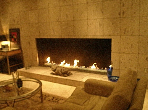 Fireplace inside walls. Is it possible to install mirror on the inside walls of a gas fireplace? How much clearance is required.