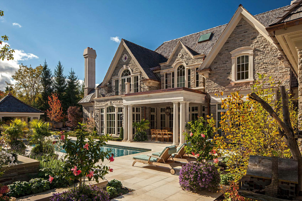 Traditional exterior in Other with stone veneer.