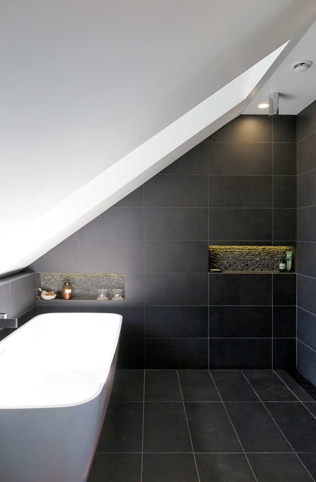 Inspiration for a small contemporary master bathroom in Sydney with flat-panel cabinets, light wood cabinets, a freestanding tub, an open shower, black tile, ceramic tile, white walls, ceramic floors, an undermount sink, marble benchtops, black floor and an open shower.