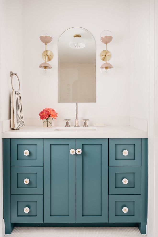 Inspiration for a transitional bathroom in San Francisco with shaker cabinets, blue cabinets, white walls, an undermount sink and white benchtops.