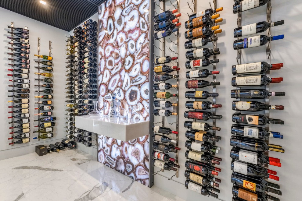 Photo of a beach style wine cellar in Miami.
