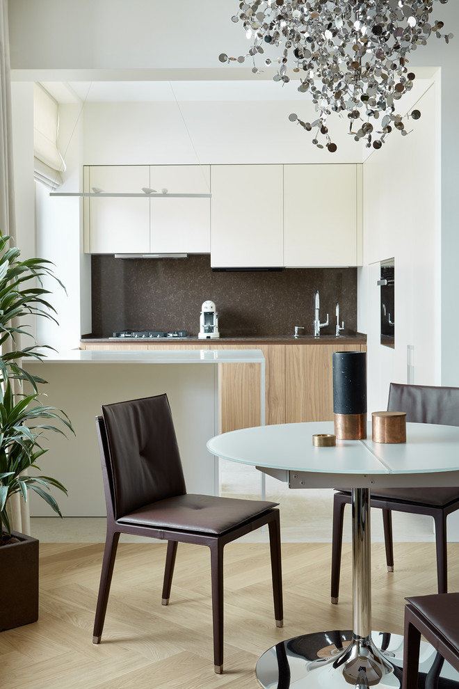 Inspiration for a contemporary open plan dining room in Moscow with white walls, light hardwood flooring and beige floors.