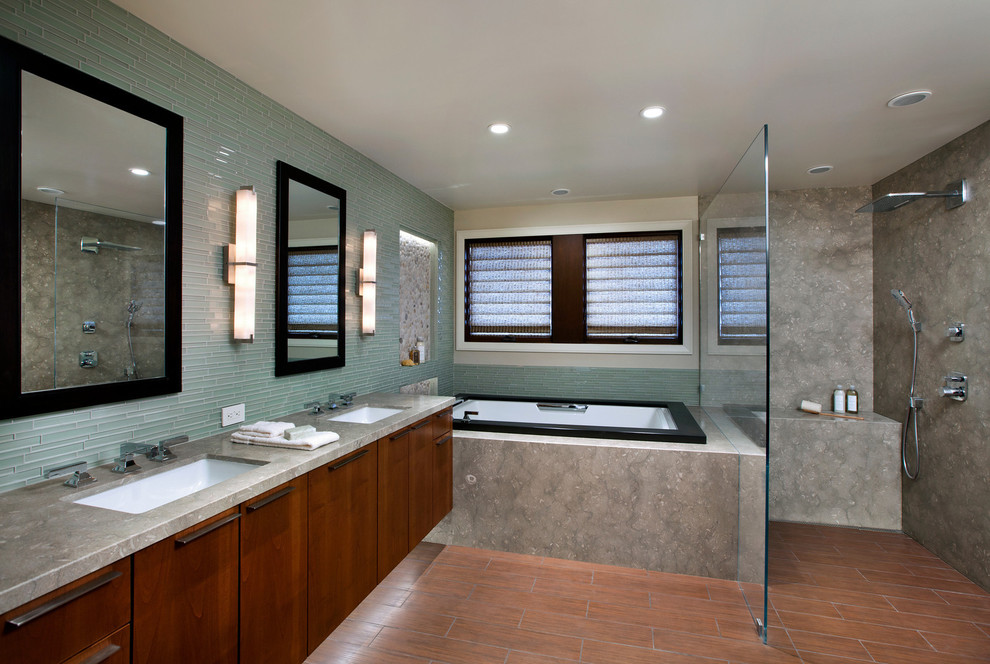 This is an example of a large contemporary master bathroom in San Francisco with flat-panel cabinets, dark wood cabinets, a drop-in tub, an open shower, gray tile, stone slab, beige walls, porcelain floors, an undermount sink, concrete benchtops, orange floor, an open shower and grey benchtops.