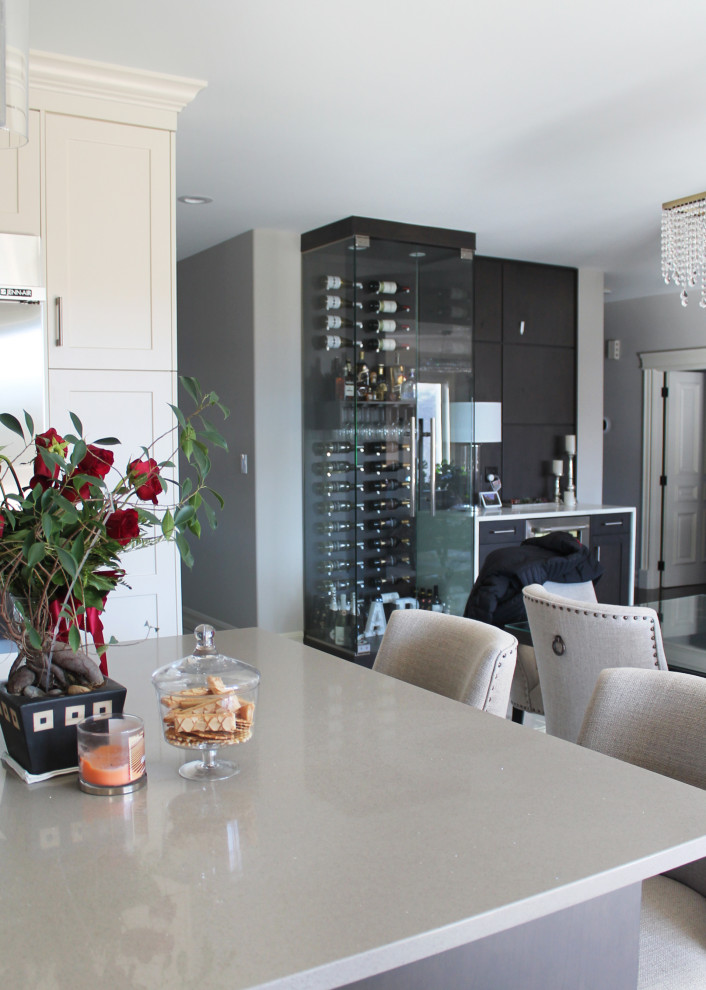Large transitional u-shaped eat-in kitchen photo with shaker cabinets, white cabinets, quartz countertops, gray backsplash, stainless steel appliances, an island and gray countertops