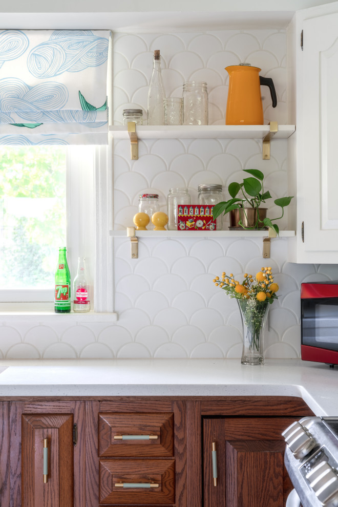 Kitchen - mid-sized eclectic u-shaped ceramic tile and white floor kitchen idea in Little Rock with a farmhouse sink, quartz countertops, white backsplash, ceramic backsplash, white appliances, an island and white countertops