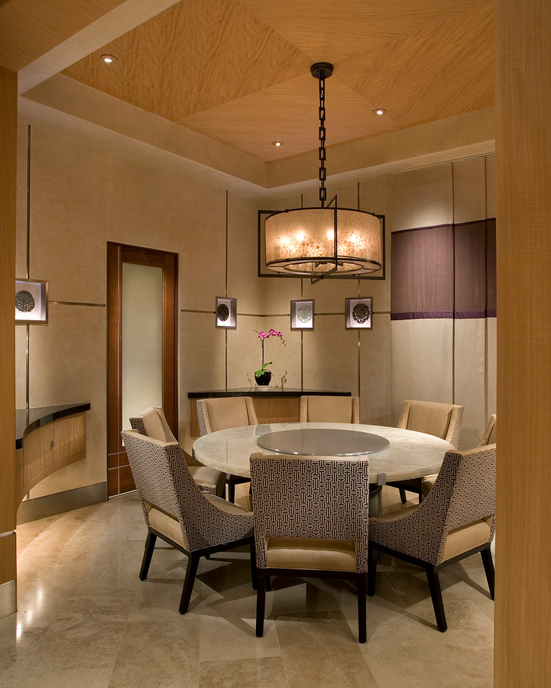 This is an example of an asian dining room in Phoenix with beige walls.