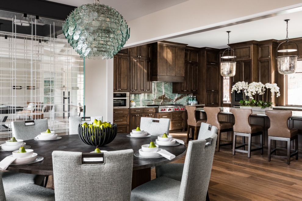 Mid-sized transitional medium tone wood floor and brown floor kitchen/dining room combo photo with beige walls