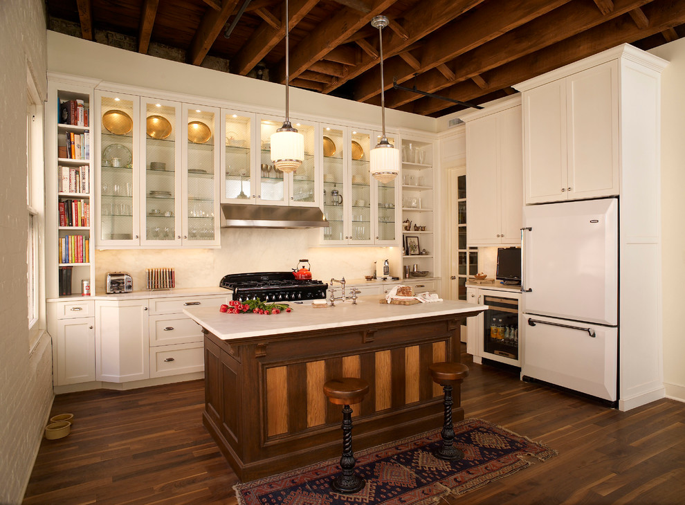 Traditional kitchen in Philadelphia with glass-front cabinets, white cabinets, white splashback and white appliances.